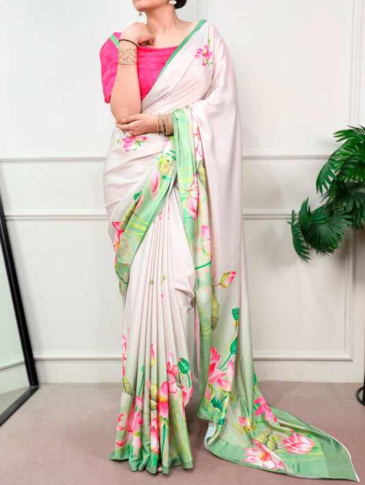 Florals that bloom forever and satin that shines softly—this saree