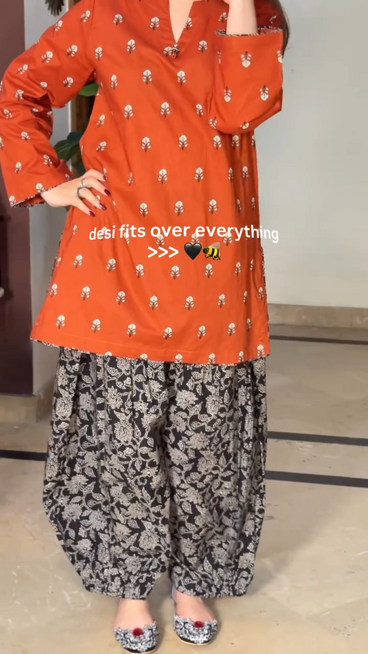 Jesvi Orange Print Kurta with Black & White Palazzo Set